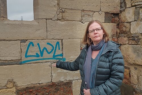 Councillor Rebecca Trimnell wants the graffiti on the side of St Oswald's Priory removed