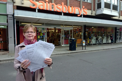 Rebecca Trimnell outside Sainsbury's with her petition