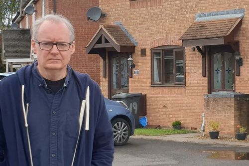 Declan Wilson outside affordable homes in Podsmead