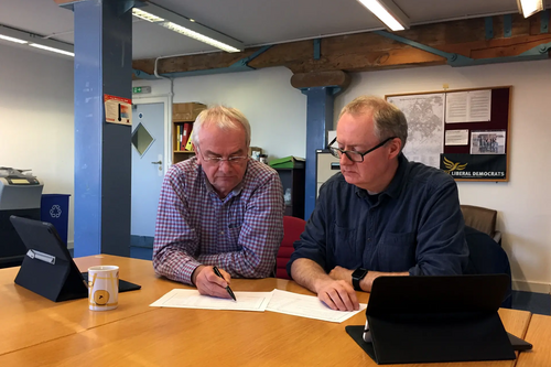 Councillors Jeremy Hilton and Declan Wilson discuss the Lib Dem budget amendments