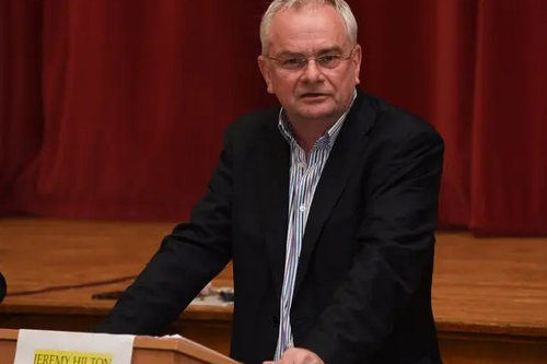 Jeremy Hilton speaking at a rostrum