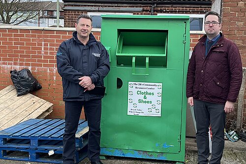 Kevin Lee, environmental crime officer at Gloucester City Council, and Councillor Sebastian Field with the clothes bank at Burns Avenue