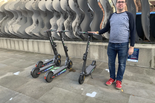 Councillor Sebastian Field with e-scooters